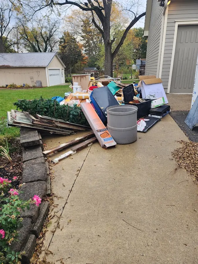Dumpster being loaded with debris for Commercial Dumpster Rental in Perryville